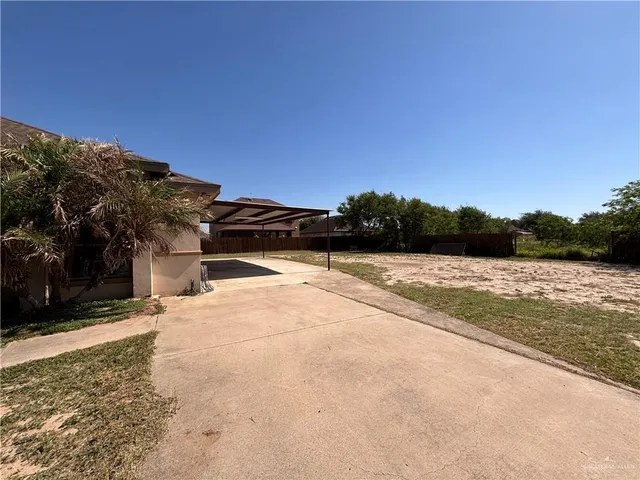 a view of a lake with a yard