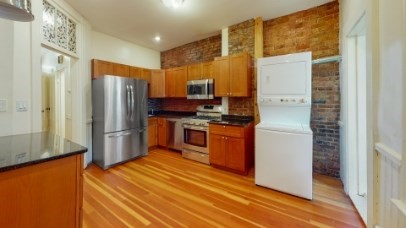 7 Mark Street, Unit 1 Boston, MA 02130 - Photo 3 of 12 a kitchen with stainless steel appliances a refrigerator and a stove top oven