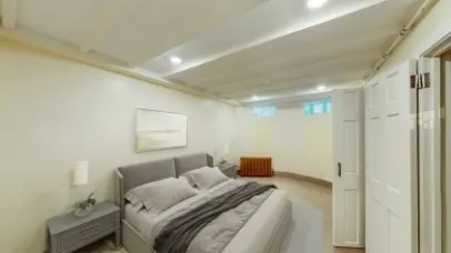 a bedroom with bed and window