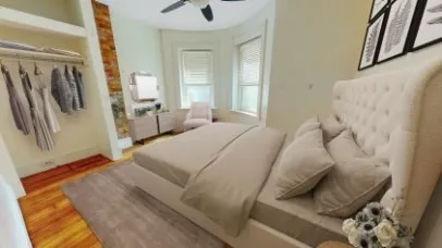 a spacious bedroom with a bed a couch and a window