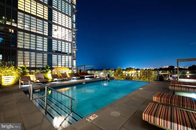 a view of a swimming pool with seating area