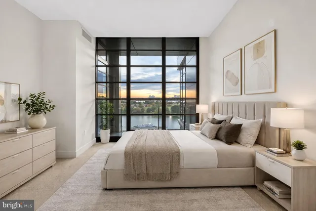 a bedroom with a large bed and a window