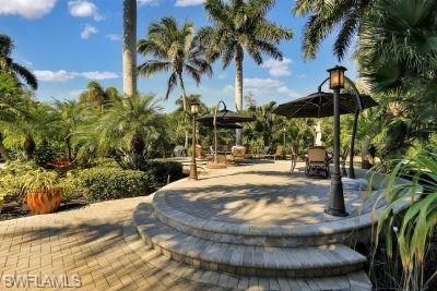 4991 Coach Lane Naples, FL 34114 - Photo 3 of 8 a view of a yard with a fountain