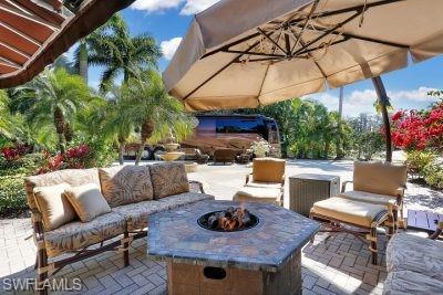 4991 Coach Lane Naples, FL 34114 - Photo 7 of 8 a view of a patio with couches and potted plants