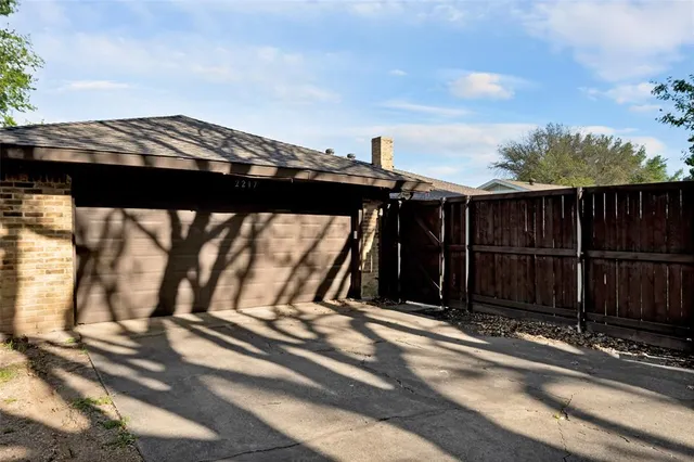 a view of house with stairs and wooden floor