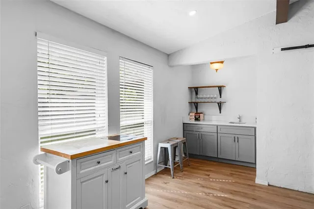a kitchen with sink cabinets and window