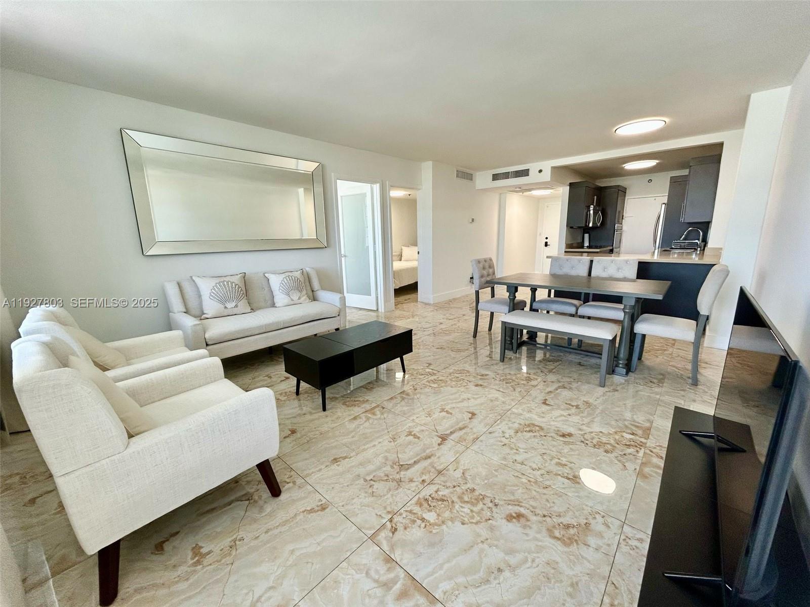 100 Lincoln Road, Unit 722 Miami Beach, FL 33139 - Photo 3 of 17 a living room with furniture and a window