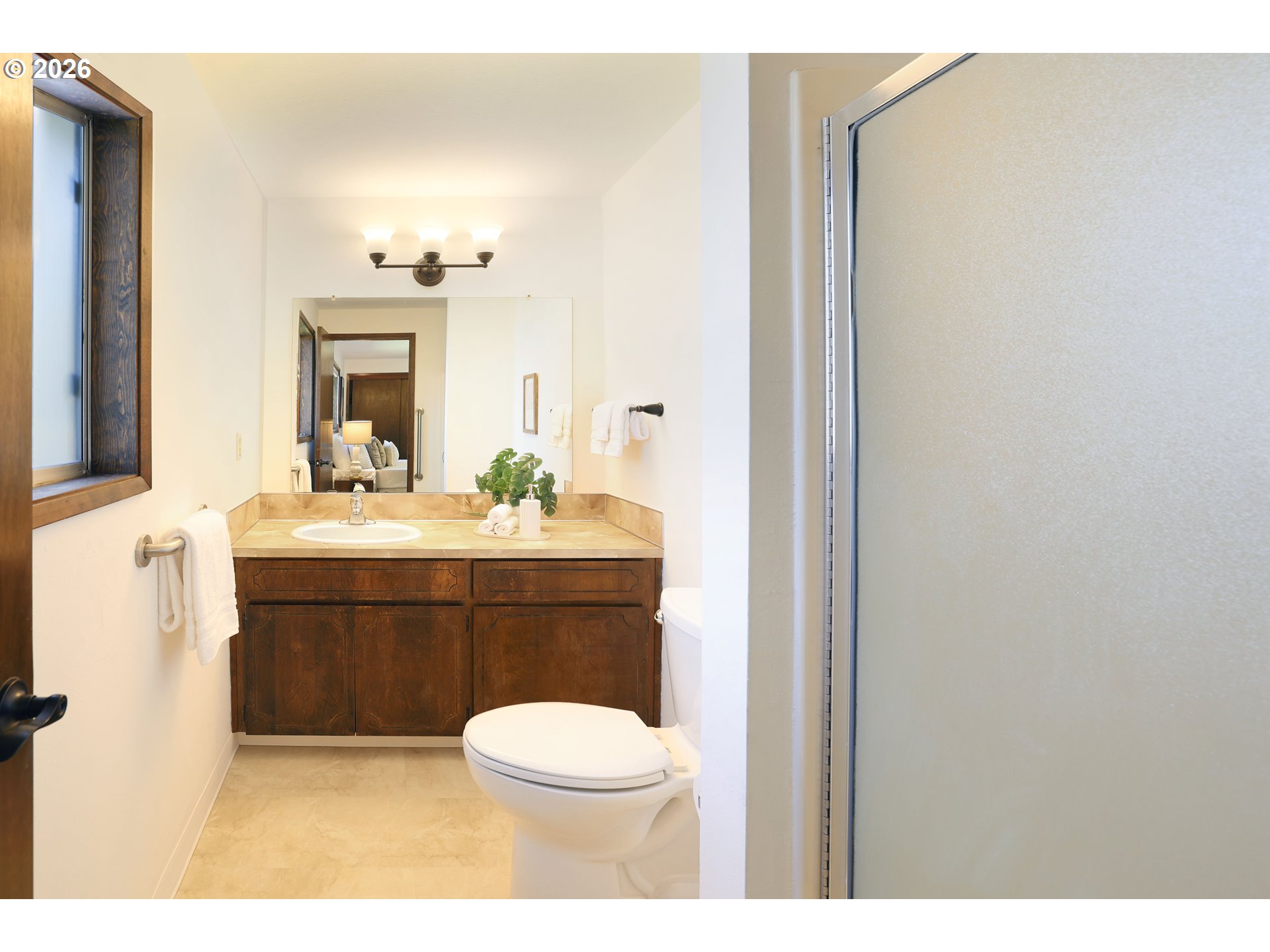 16285 Southwest Rosa Road Beaverton, OR 97007 - Photo 9 of 20 a bathroom with a sink vanity mirror and toilet