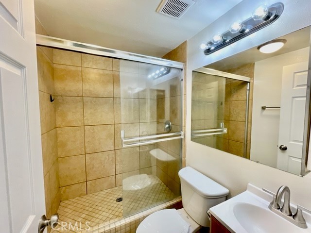 79380 Ave 42, Unit 2 Bermuda Dunes, CA 92203 - Photo 12 of 15 a bathroom with a shower and a sink