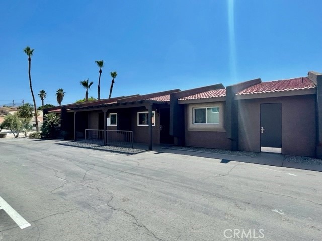 79380 Ave 42, Unit 2 Bermuda Dunes, CA 92203 - Photo 15 of 15 a front view of a house with a garage