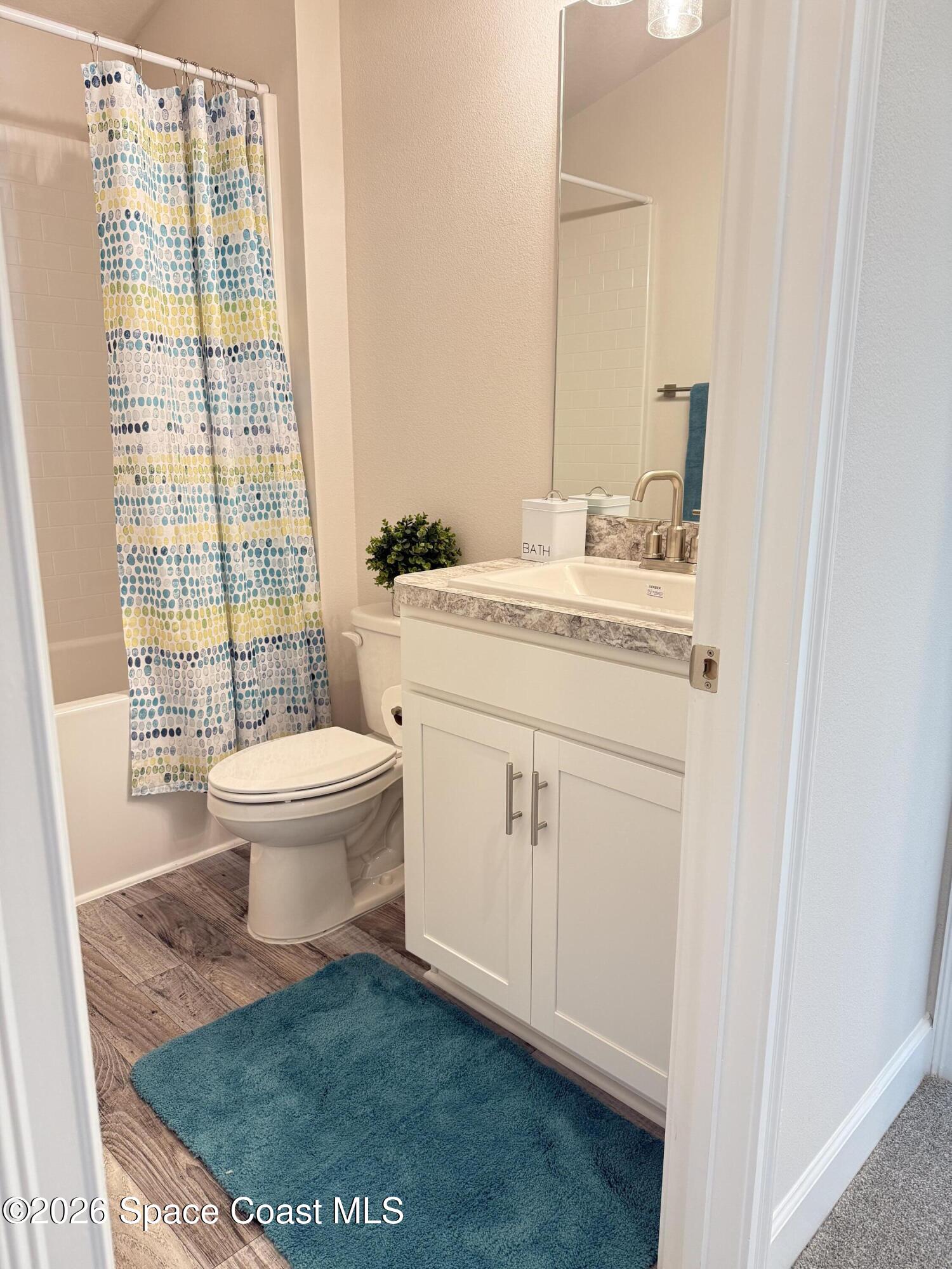 302 Quarry Lane Sebastian, FL 32958 - Photo 19 of 22 a bathroom with a sink toilet and window