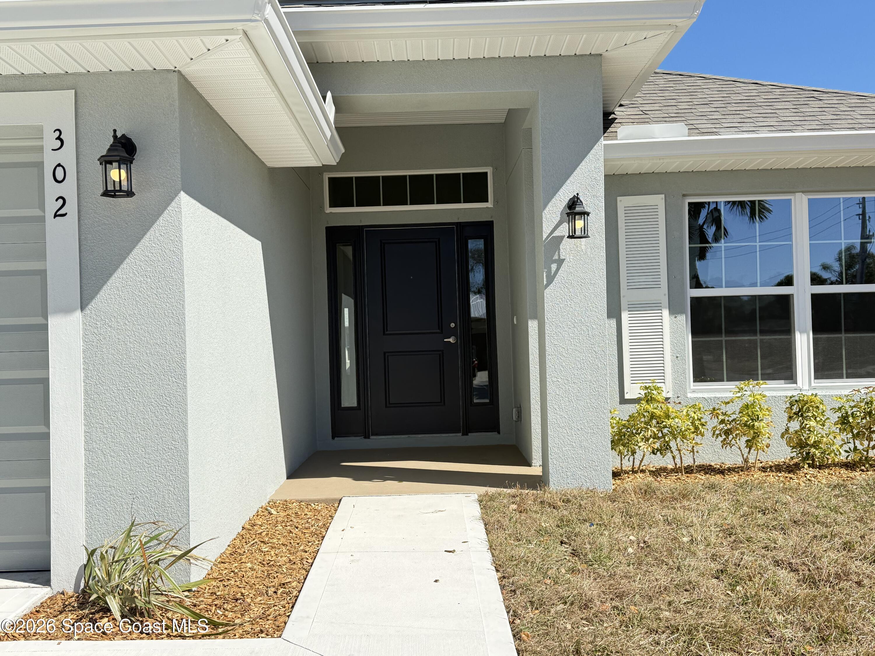 302 Quarry Lane Sebastian, FL 32958 - Photo 9 of 22 a view of front door of house