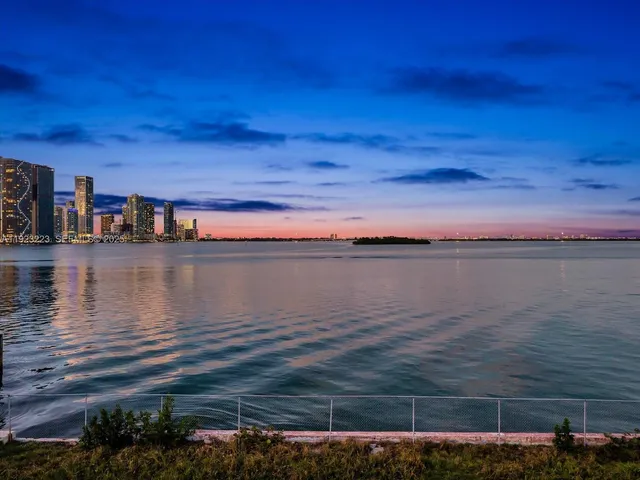 a view of a city with an ocean