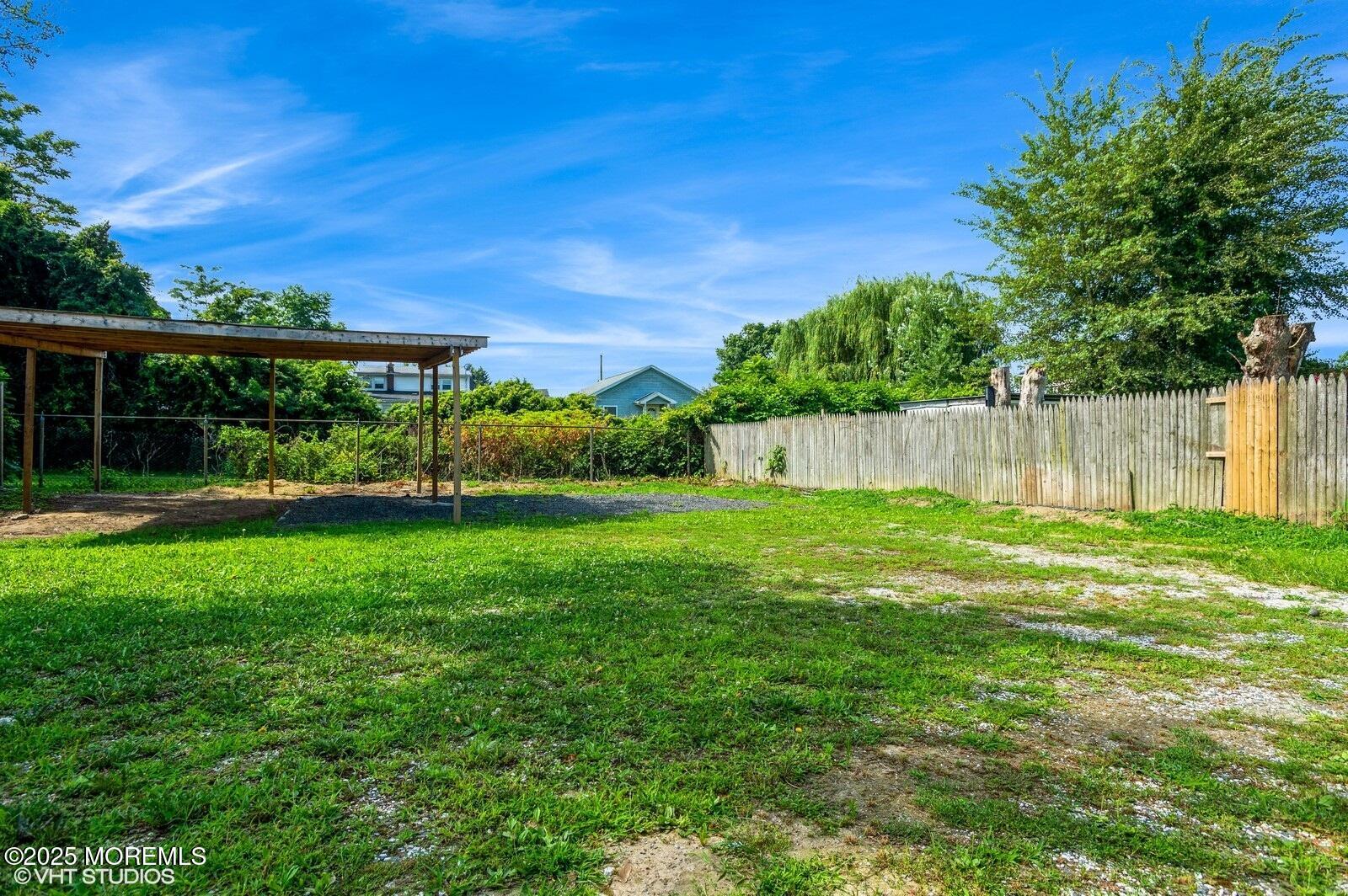 118 Joline Avenue, Unit 1 Long Branch, NJ 07740 - Photo 18 of 21 a view of a garden with a tree in the background