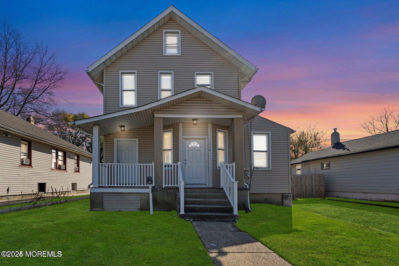 118 Joline Avenue, Unit 1 Long Branch, NJ 07740 - Photo 2 of 21 a front view of a house with a yard