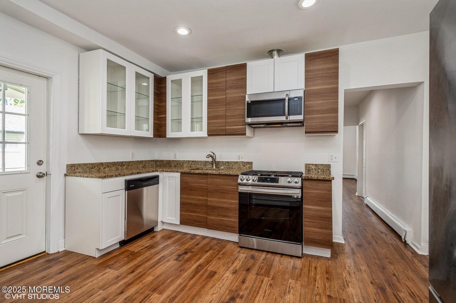 118 Joline Avenue, Unit 1 Long Branch, NJ 07740 - Photo 9 of 21 a kitchen with stainless steel appliances granite countertop a stove and a sink