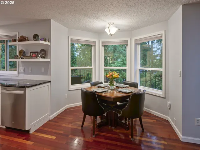 a view of a dining room with furniture window and outside view