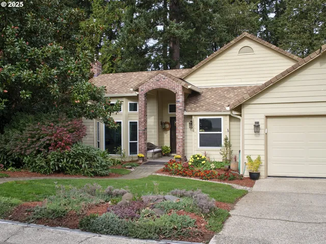 a front view of a house with garden