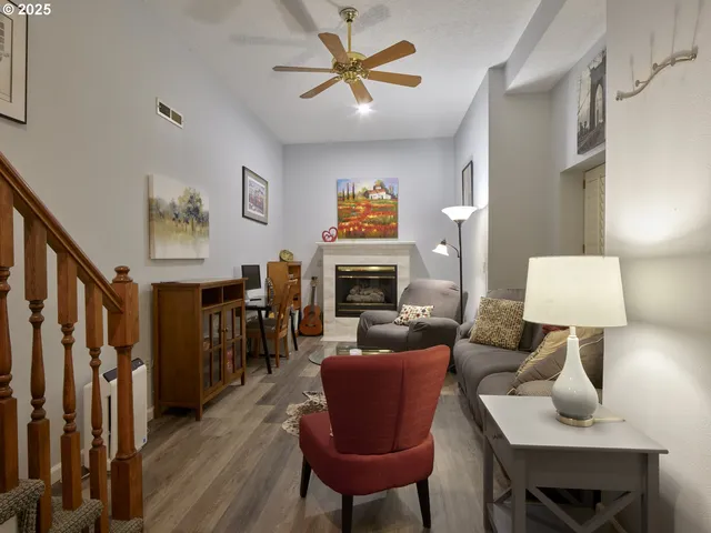 a living room with furniture a lamp and a fireplace