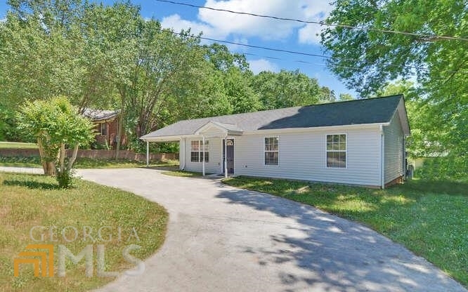 230 Collins Road Toccoa, GA 30577 - Photo 1 of 1 a front view of a house with garden