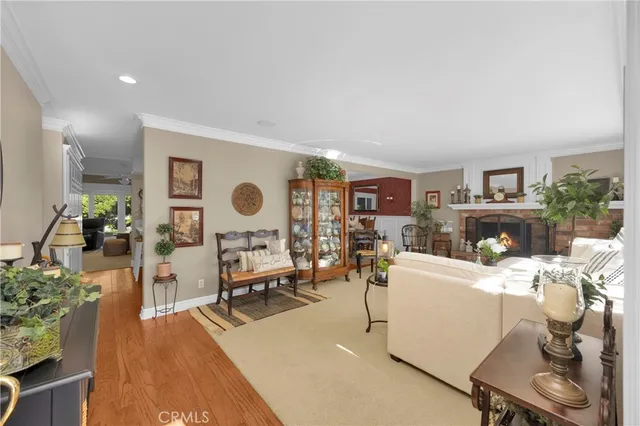 a living room with furniture a rug and a large window