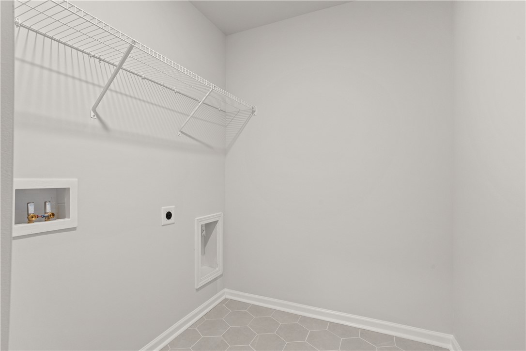 629 Sweetspire Trail, Unit 149 Seneca, SC 29678 - Photo 25 of 30 A dedicated utility space with contemporary flooring and shelving offers practical daily living.