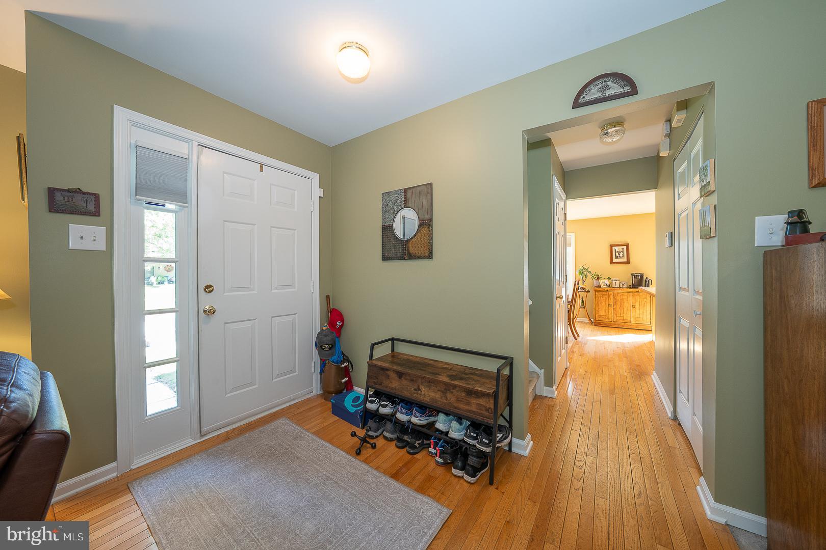 224 Fox Run Exton, PA 19341 - Photo 4 of 40 a view of a hallway with wooden floor and a bedroom