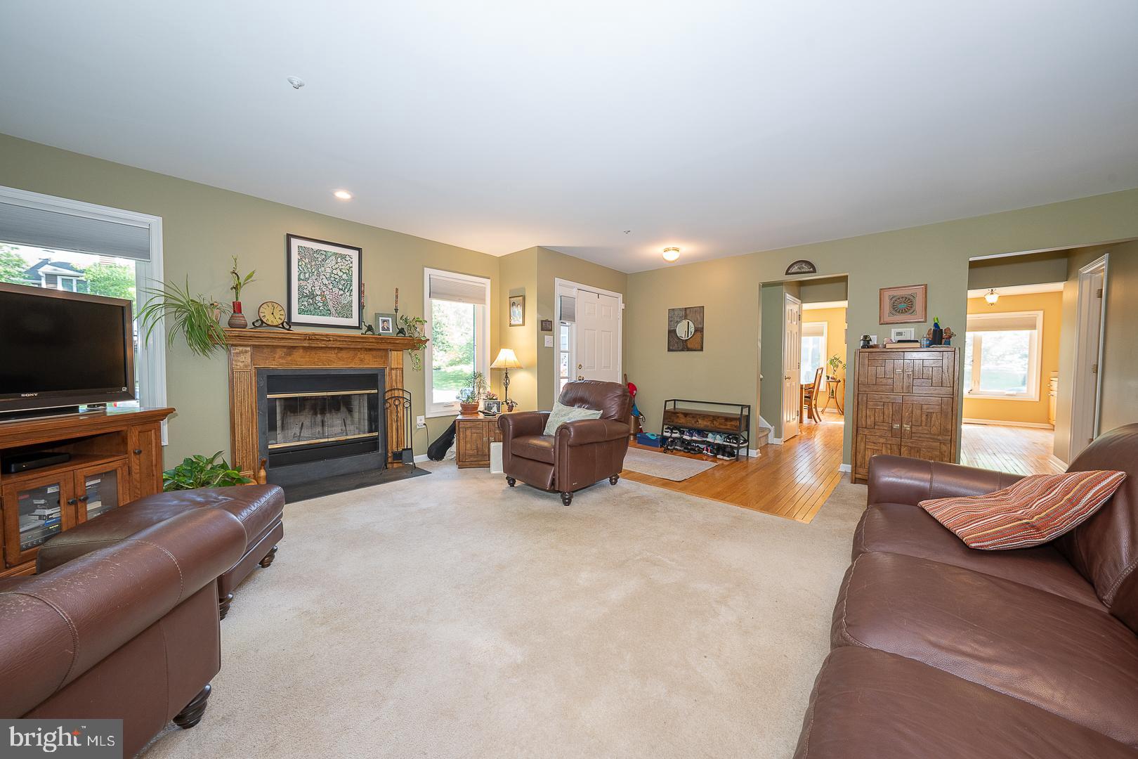 224 Fox Run Exton, PA 19341 - Photo 6 of 40 a living room with furniture a flat screen tv and a fireplace