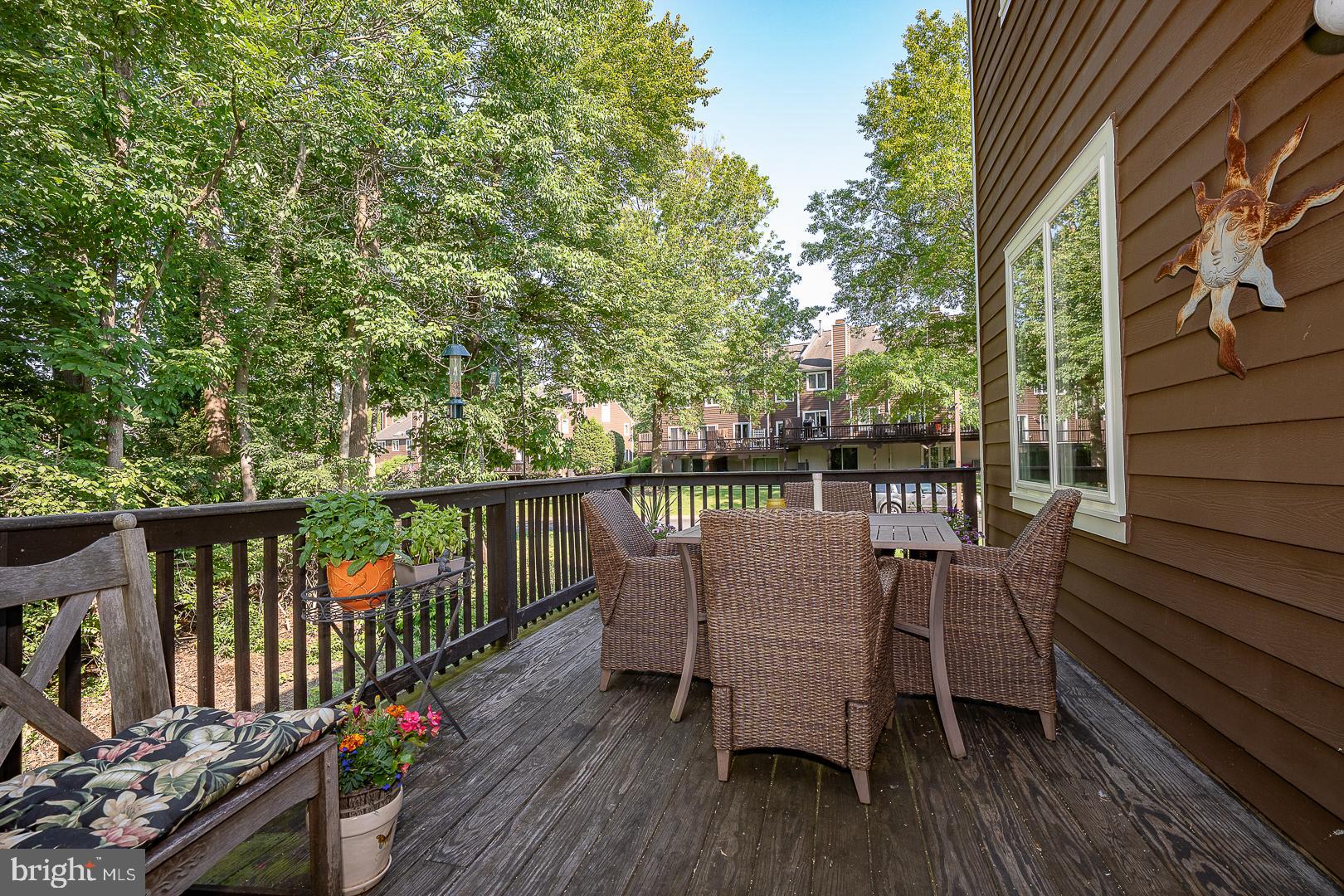 224 Fox Run Exton, PA 19341 - Photo 7 of 40 a view of a deck with two chair and a floor to ceiling window