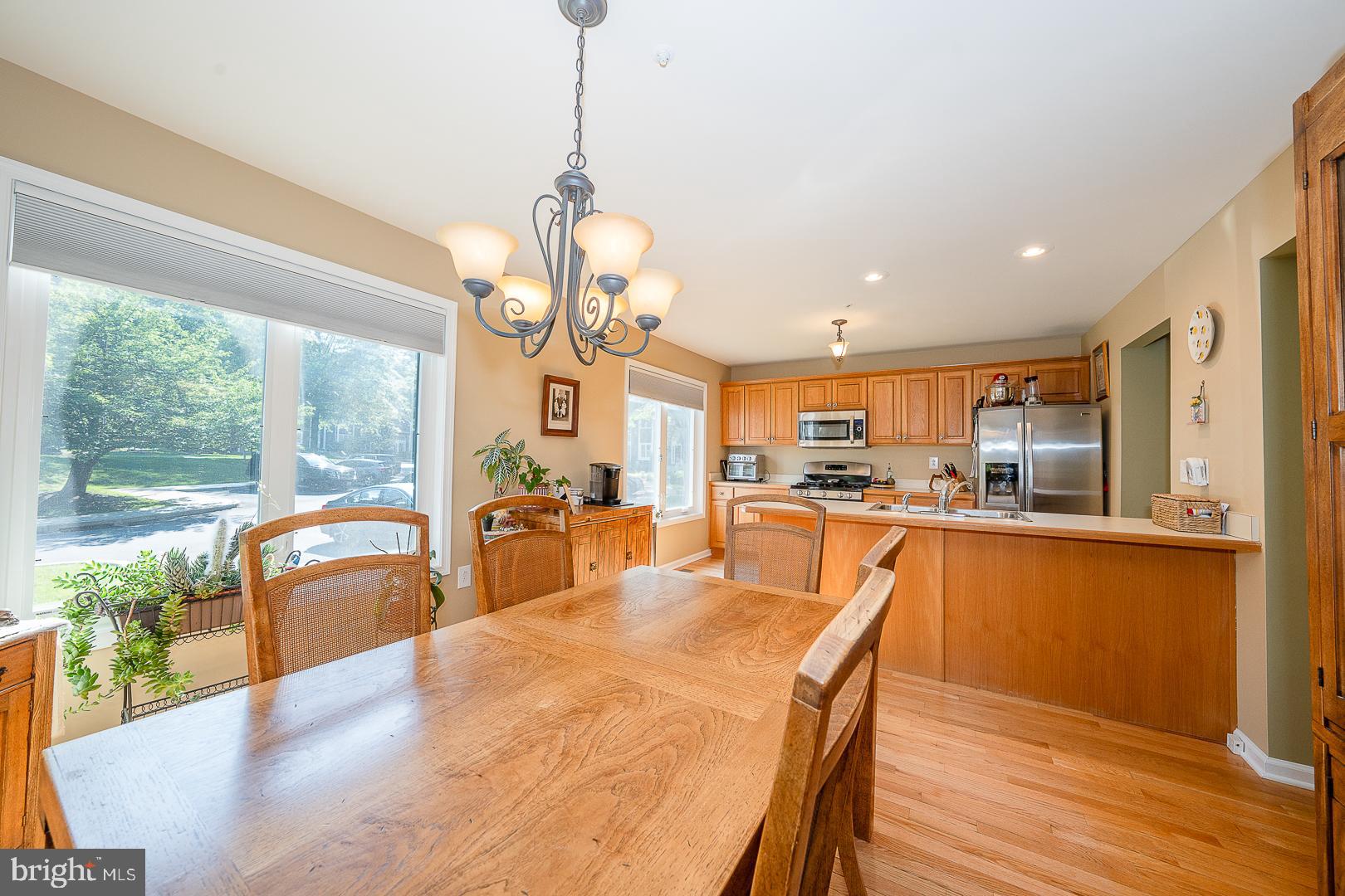 224 Fox Run Exton, PA 19341 - Photo 9 of 40 a view of a dining room and livingroom with furniture wooden floor a chandelier