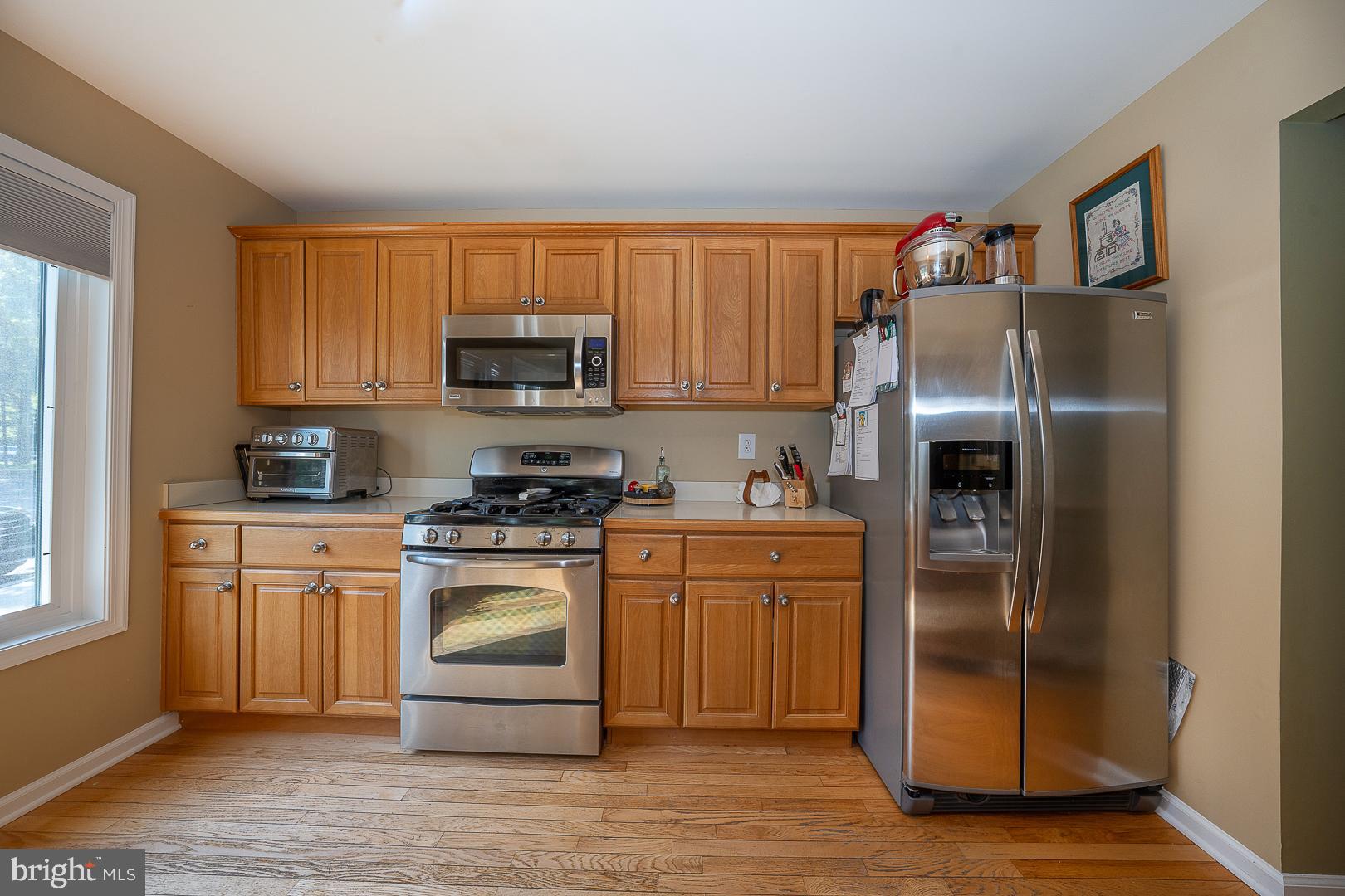 224 Fox Run Exton, PA 19341 - Photo 10 of 40 a kitchen with stainless steel appliances granite countertop a refrigerator stove and sink