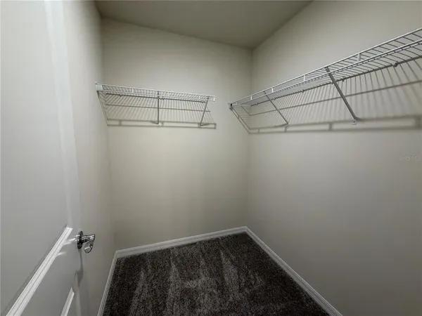 a view of a room with racks on the wall