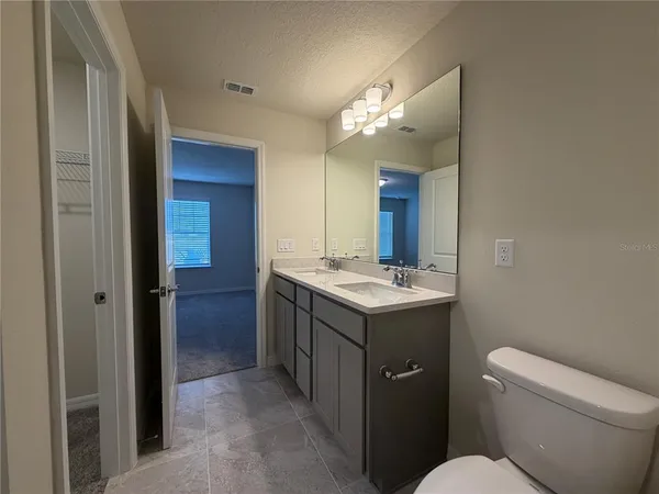 a bathroom with a sink a toilet and a bathtub