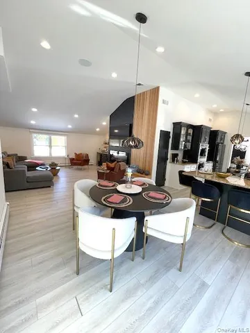 a dining room with furniture and window