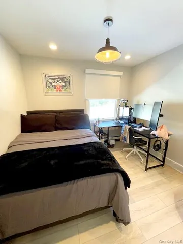 a view of a swimming pool and lounge chairs