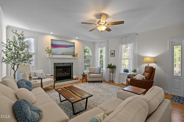 a living room with furniture and a fireplace
