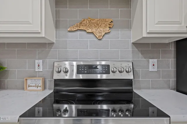 a close view of a sink and a cabinet in a kitchen