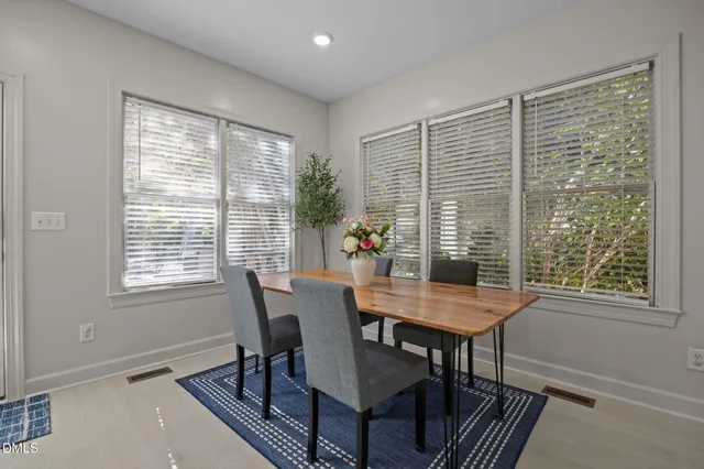 a bed room with a bed and a chair