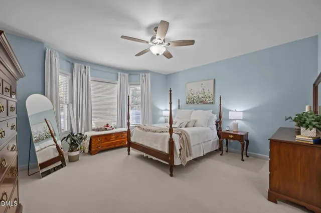 a bathroom with a granite countertop sink a large mirror and a shower
