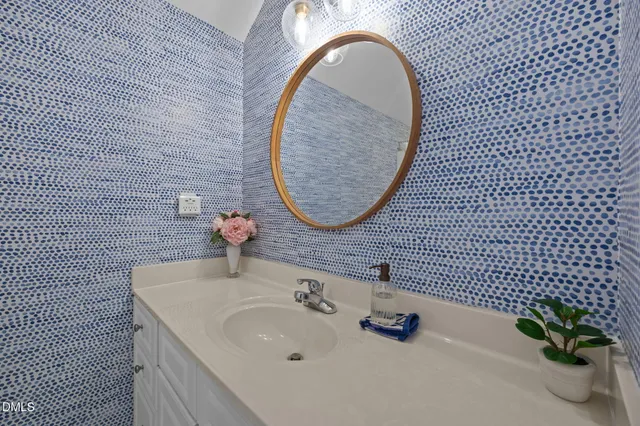 a bedroom with two beds and a large window