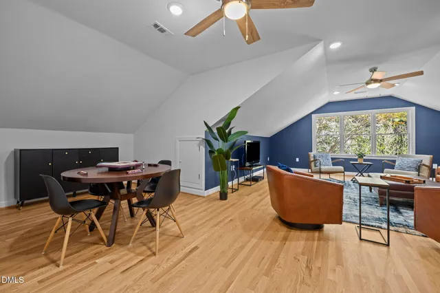 an aerial view of a house with a yard and garden