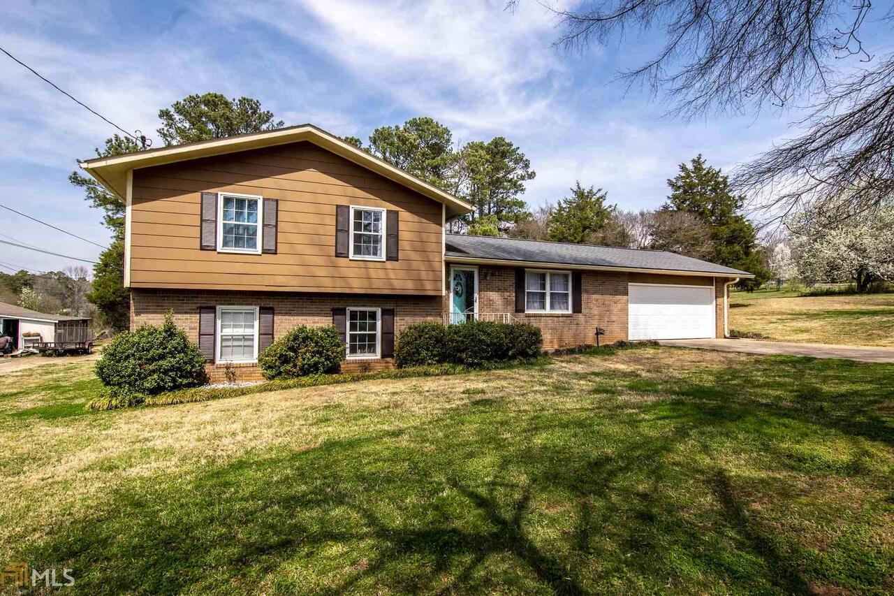 2 Camelia Lane Northeast Rome, GA 30161 - Photo 1 of 1 a front view of a house with a yard