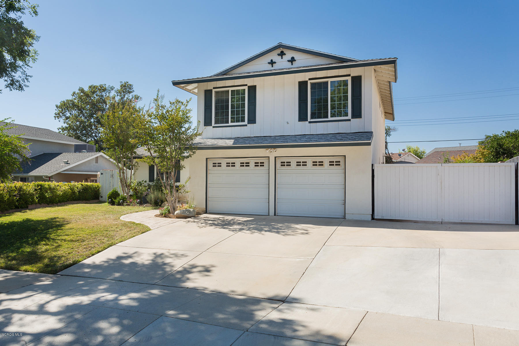 648 Appleton Road Simi Valley, CA 93065 - Photo 2 of 42 a front view of a house with a yard and garage