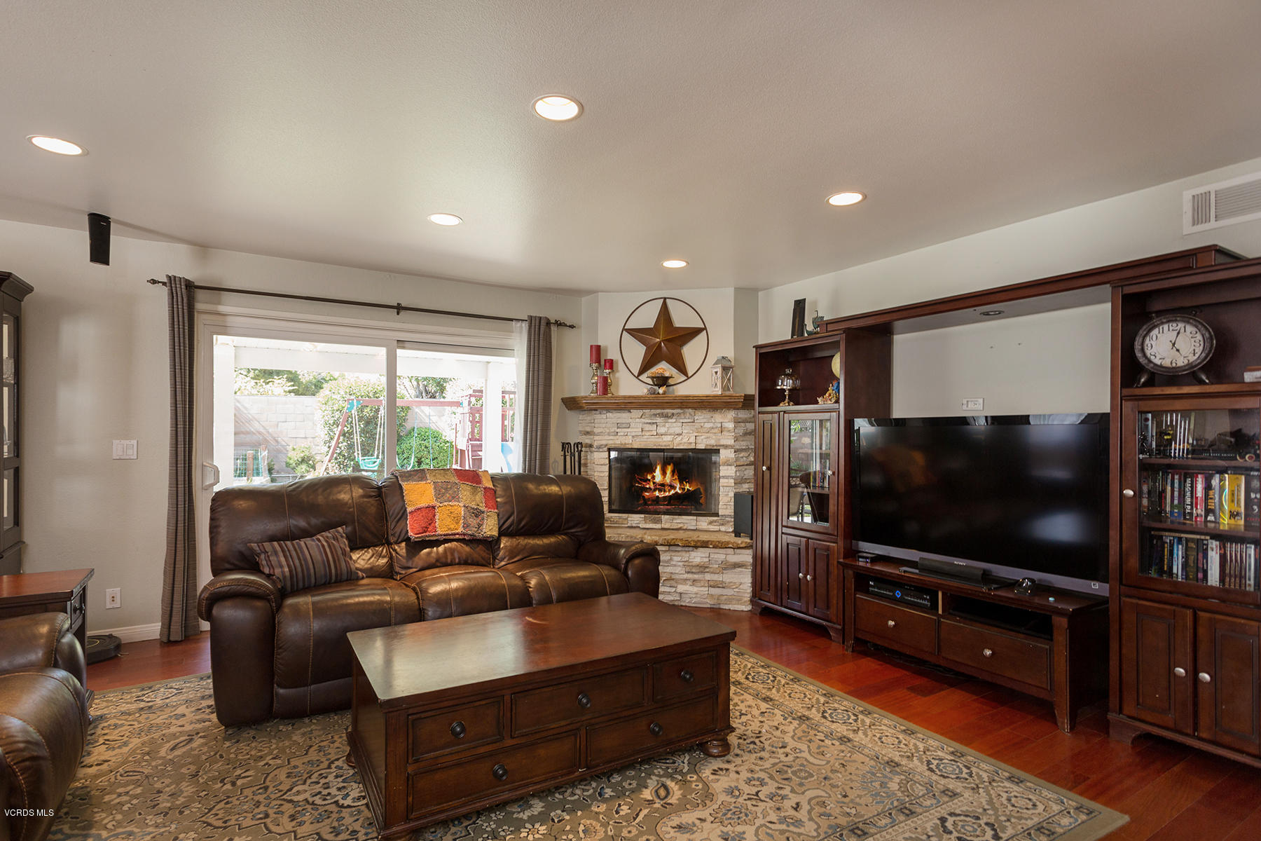 648 Appleton Road Simi Valley, CA 93065 - Photo 11 of 42 a living room with furniture and a flat screen tv