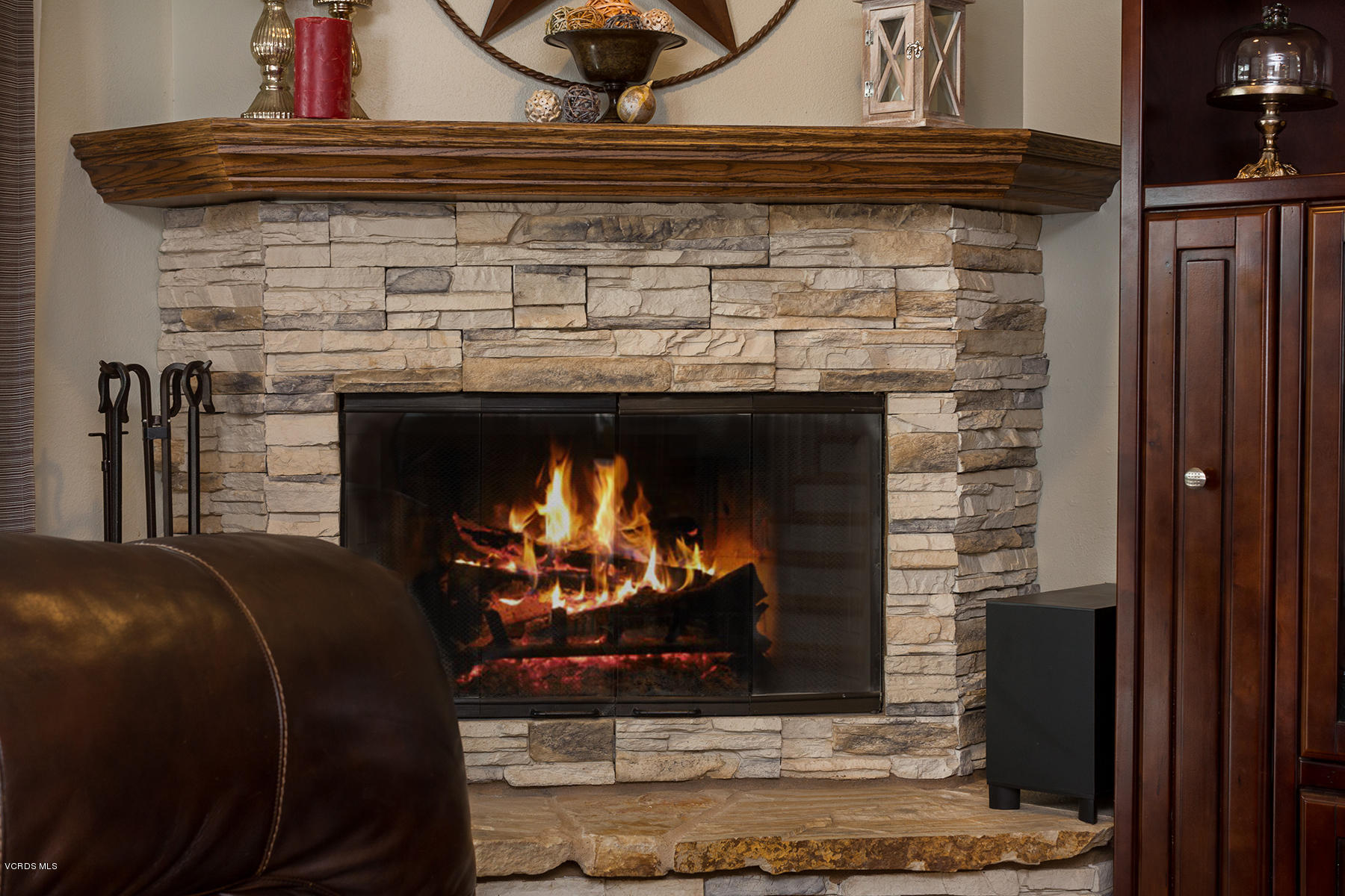 648 Appleton Road Simi Valley, CA 93065 - Photo 13 of 42 a fireplace with a vase on top of it