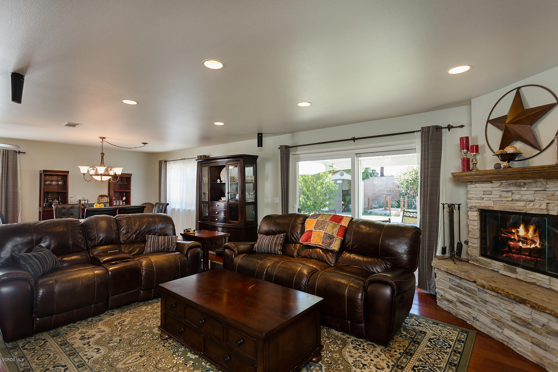 648 Appleton Road Simi Valley, CA 93065 - Photo 14 of 42 a living room with furniture a fireplace and a flat screen tv