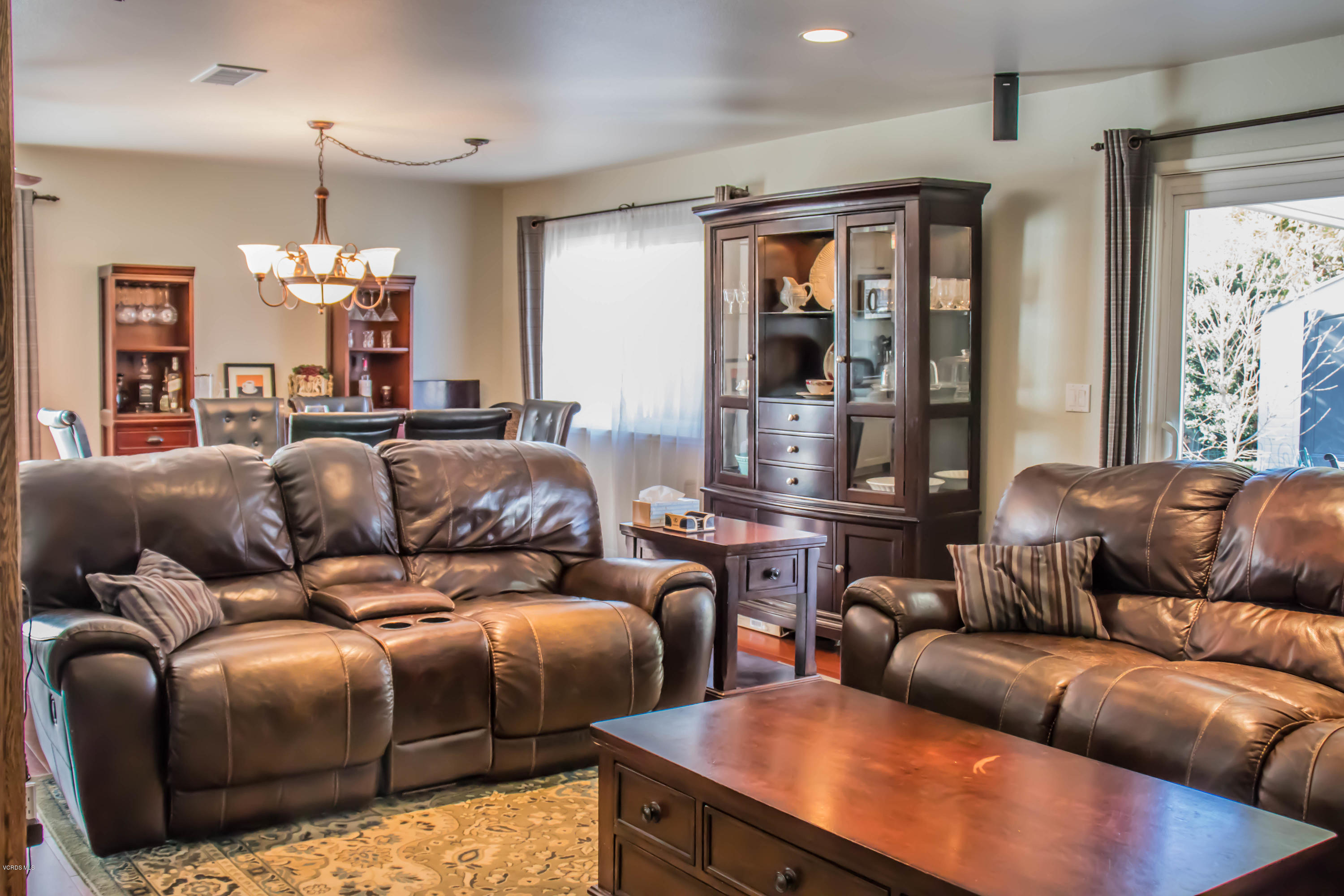 648 Appleton Road Simi Valley, CA 93065 - Photo 15 of 42 a living room with furniture and a chandelier
