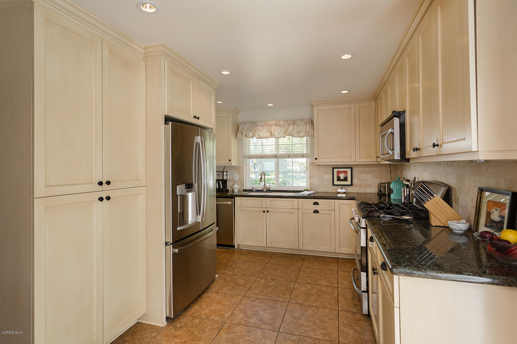 648 Appleton Road Simi Valley, CA 93065 - Photo 19 of 42 a kitchen with a sink stove and refrigerator