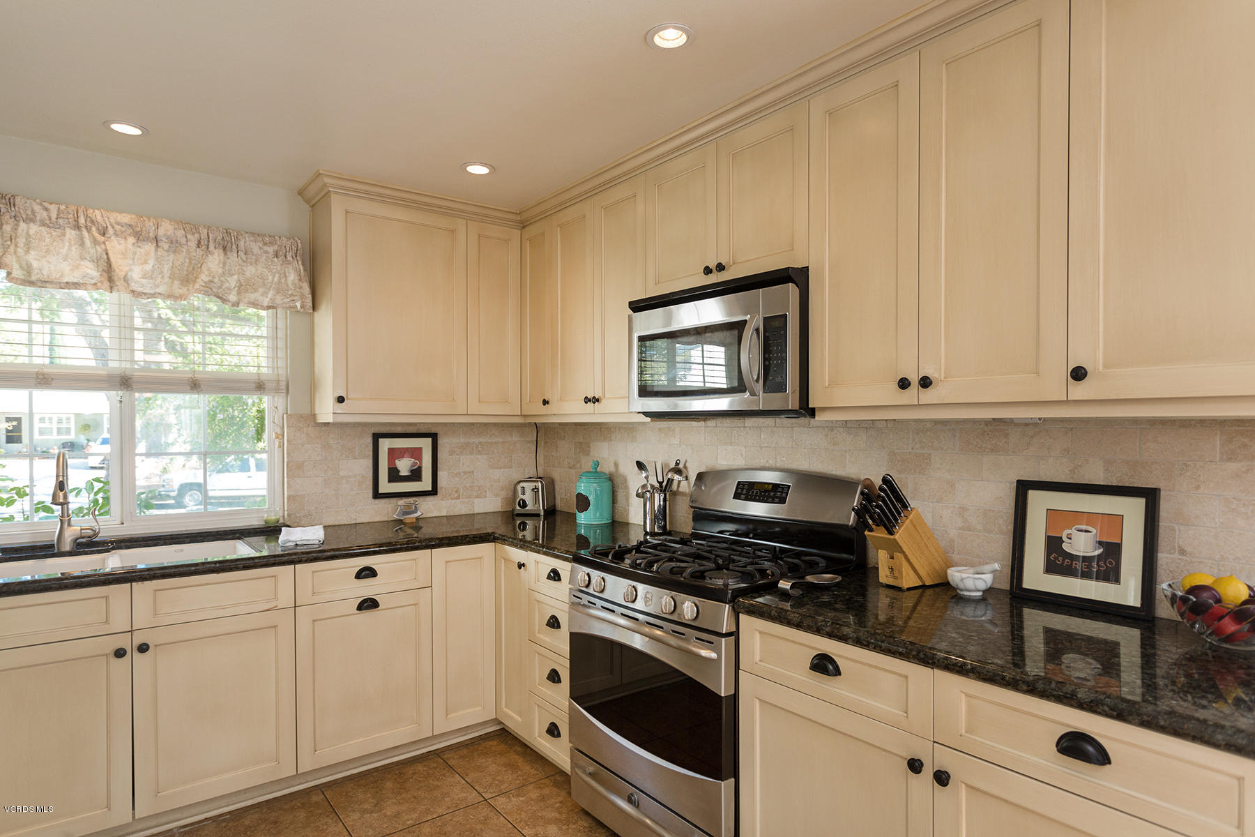 648 Appleton Road Simi Valley, CA 93065 - Photo 20 of 42 a kitchen with granite countertop white cabinets and white appliances