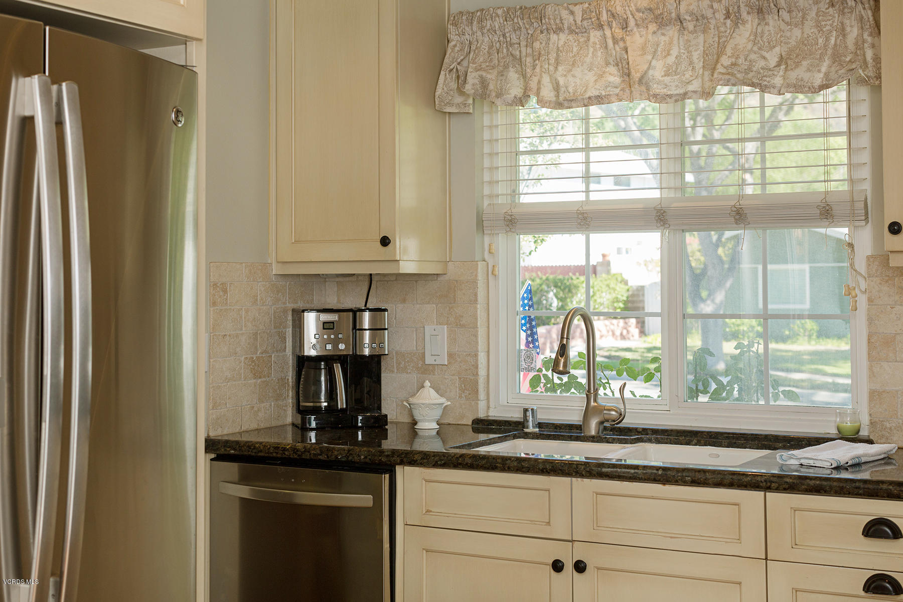 648 Appleton Road Simi Valley, CA 93065 - Photo 21 of 42 a kitchen with granite countertop a sink and a window